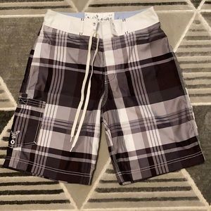 Men’s plaid board shorts worn one time.